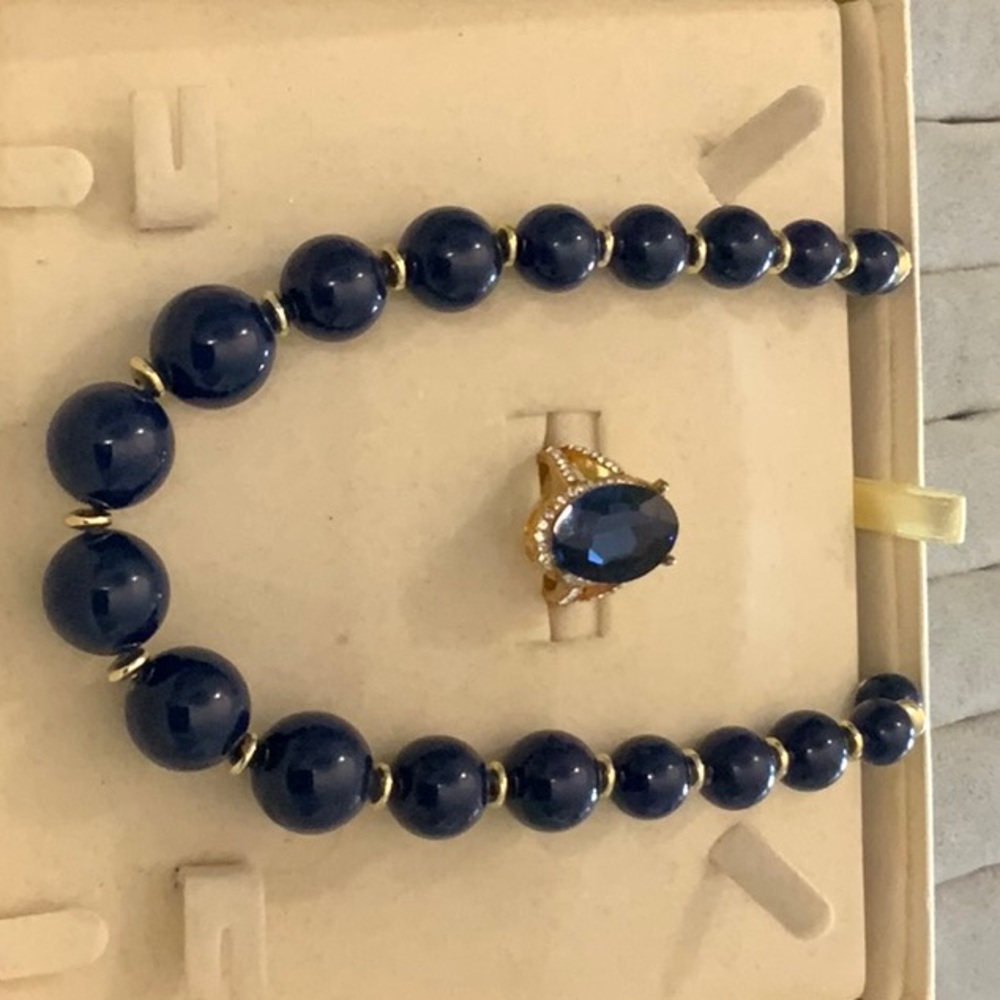 Beutiful neckless and matching ring.  The proceeds will feed the needy.